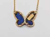 gold plated necklace with a blue butterfly pendant on a gold chain
