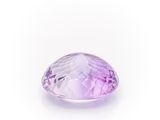 a close up of a purple amethorate stone on a white background