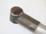 a metal pipe with a rusted cap on it
