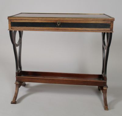 an old wooden table with a glass top and metal legs