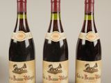 trois bouteilles de vin posées l'une à côté de l'autre sur une table