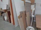 many pieces of wood stacked up in a room