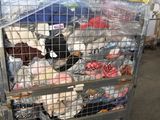 a cart full of stuffed animals inside of a building