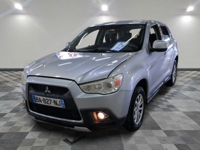 a picture of a silver car parked in a showroom
