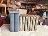 a lot of books that are sitting on a table