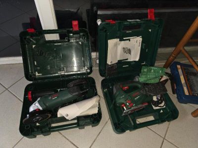 two tools in a case on the floor next to a chair