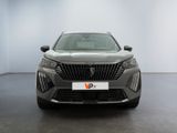 the front view of a grey car in a showroom