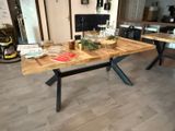 a wooden table with a book on it in a living room