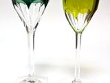 two wine glasses sitting next to each other on a table