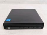 the back of a laptop computer sitting on top of a white surface