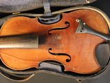 a violin that is in a case on a table