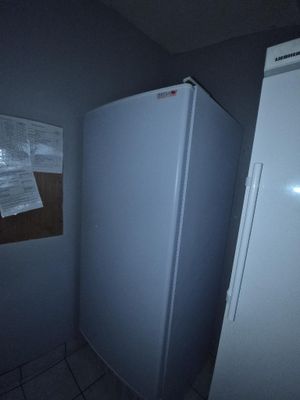 an image of a refrigerator in a dark room