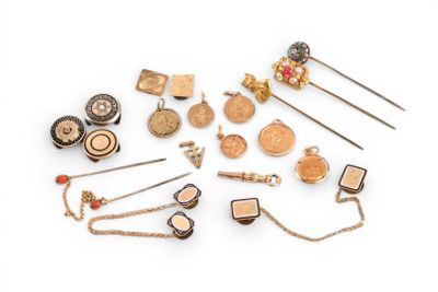 many different types of brooches and pins on a white surface
