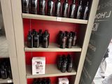 many bottles of hair products on the shelves in the store