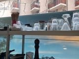a shelf with a lot of cups and glasses on it