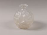 a glass vase that is sitting on a table