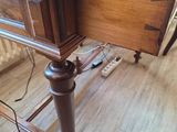 a wooden desk with a laptop on top of it