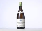 the bottle of wine is sitting on the table with a white background