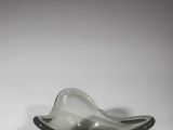 a glass bowl that is sitting on a table