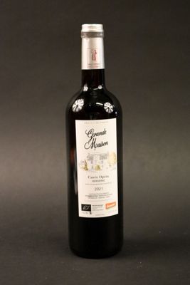a bottle of wine that is sitting on a table