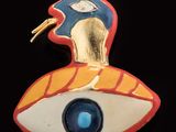 an image of a close up of a brooch with a bird on it