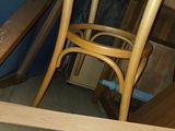 a wooden table with a chair on top of it