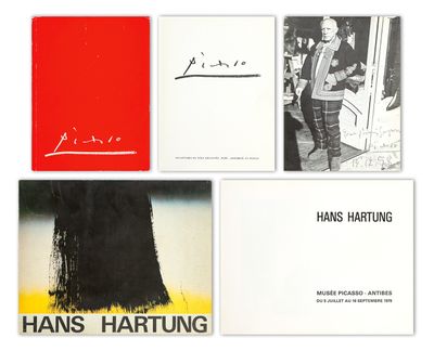 four books with a picture of a man in a suit and a woman in a black dress