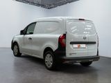 the back end of a white van parked in a garage