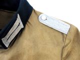 a close up of a jacket with a metal button on it