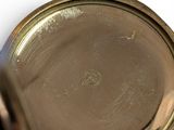a close up of a gold plate with a picture on it