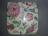 a picture of a tile with flowers on it