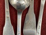 three spoons and a spoon with a note on them