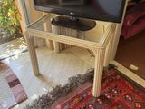 a television that is sitting on top of a glass table
