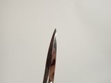 a person holding a pair of scissors in their hand