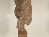 statue of a woman with a hat on her head