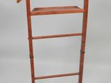 an image of a wooden clothes rack with a coat hanger