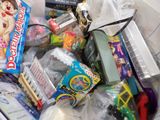 a lot of toys in a plastic bag on the floor