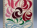 un vieux livre dont la couverture est ornée d'un motif floral