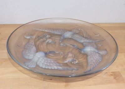 a glass bowl that has two fish in it