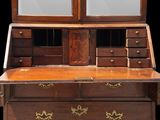 a wooden desk with a mirror on top of it