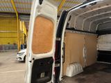a white van that is parked inside of a building