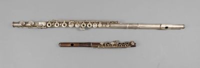 a flute and a flute case on a table