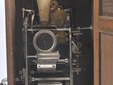 a very old clock that is in a wooden case