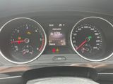 a close up of a car dashboard with various gauges