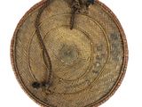a wicker basket with a handle on a white background