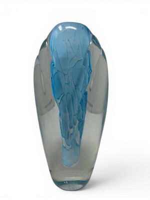 a glass vase with a blue design on it