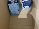 cans of soda and cans of water in a box
