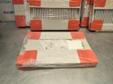 many boxes of luggage sitting on a metal surface