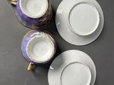 three cups and saucers are sitting on a table next to each other