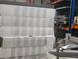 a stack of boxes sitting on a pallet in a warehouse